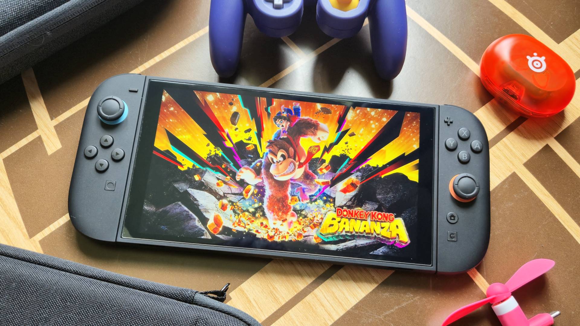 Photo by Rosalie Newcombe of the Nintendo Switch 2 sitting on a coffee table surrounded by accessories.